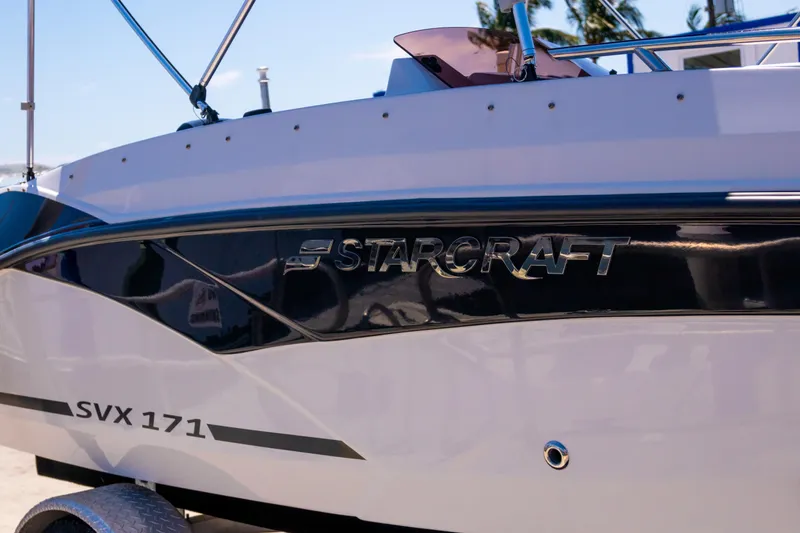 Slide: The Image of 2023 Starcraft SVX 171 OB boat side view with logo and model name. - 7