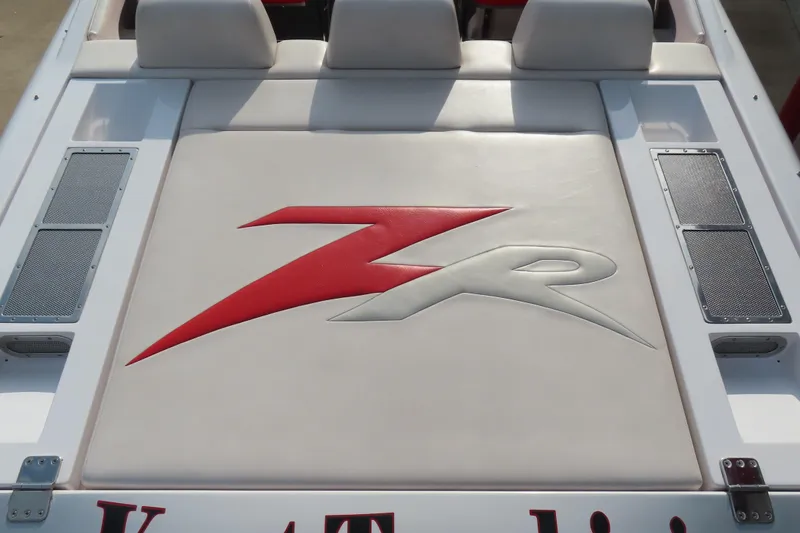 Slide: The Image of 2007 Donzi 35 ZR boat with red and white logo on cushioned deck. - 12