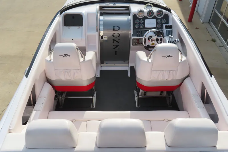 Slide: The Image of 2007 Donzi 35 ZR boat interior with white seating and modern dashboard controls. - 14