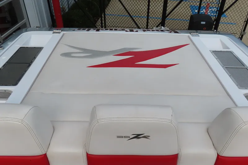 Slide: The Image of 2007 Donzi 35 ZR boat interior with logo on white and red seating. - 25