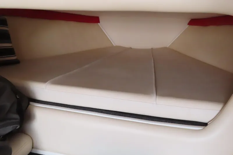 Slide: The Image of Interior cabin of 2007 Donzi 35 ZR boat with cushioned seating. - 27