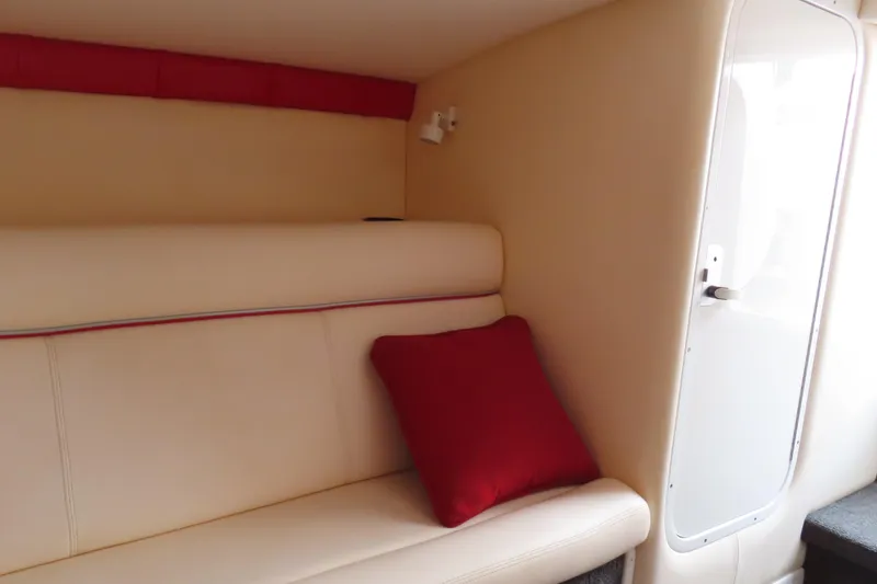 Slide: The Image of Interior of 2007 Donzi 35 ZR boat with cream seating and red cushion. - 29