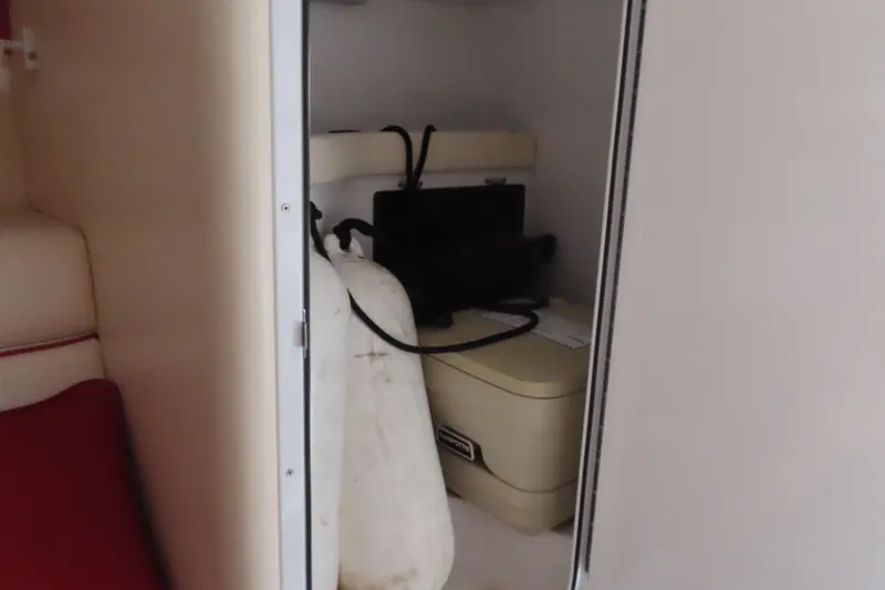 Slide: The Image of Interior of 2007 Donzi 35 ZR boat showing storage area and equipment. - 30
