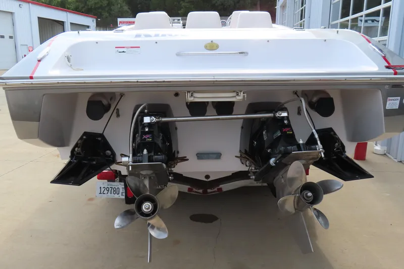 Slide: The Image of 2007 Donzi 35 ZR boat rear view with dual propellers and outboard engines. - 8