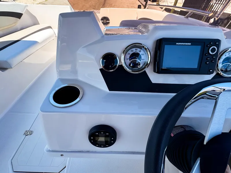 Slide: The Image of 2023 Starcraft SVX 171 OB boat dashboard with gauges and navigation system. - 13