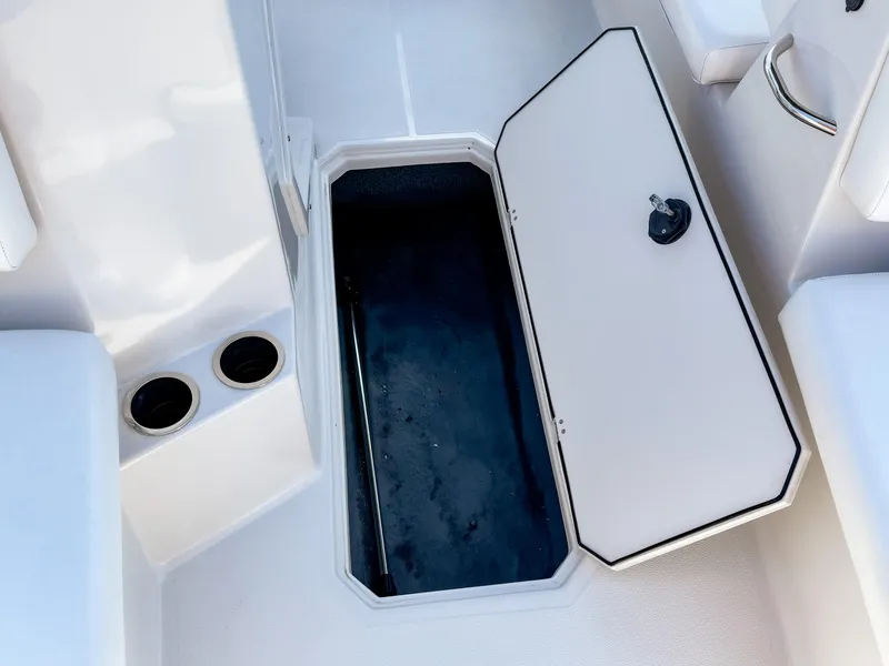 Slide: The Image of Open storage compartment on 2023 Starcraft SVX 171 OB boat deck. - 18