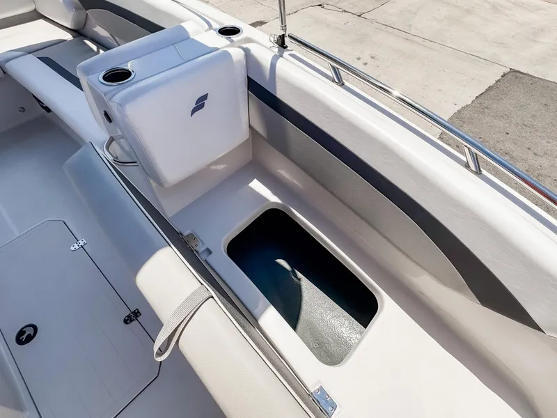 Slide: The Image of 2023 Starcraft SVX 171 OB boat interior with seating and storage compartment. - 22
