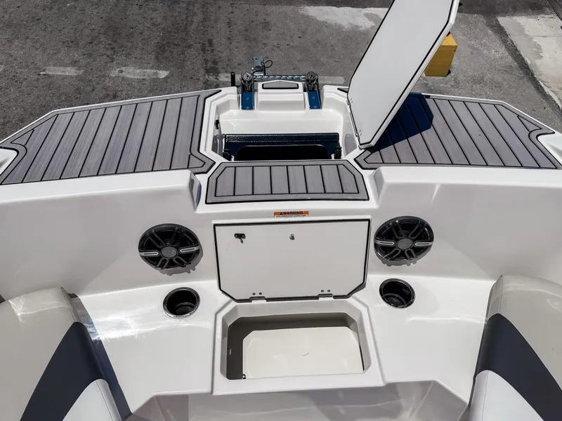 Slide: The Image of 2023 Starcraft SVX 171 OB boat interior with storage compartments and speakers. - 24