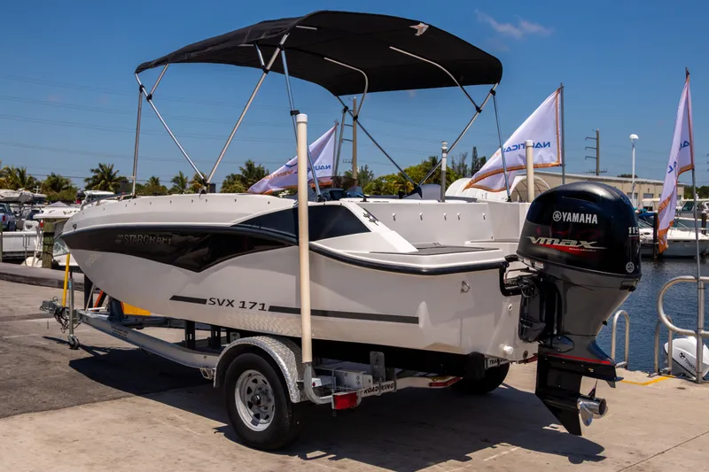Slide: The Image of 2023 Starcraft SVX 171 OB boat with Yamaha outboard motor on trailer at marina. - 4