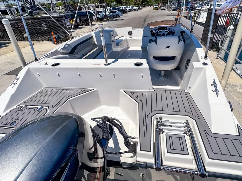 Slide: The Image of 2023 Starcraft SVX 171 OB boat interior with seating and steering console. - 8