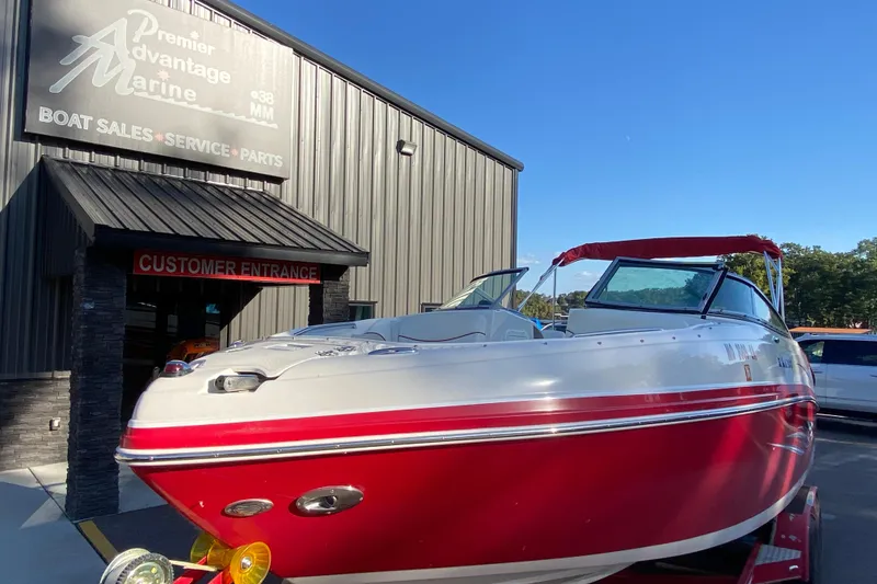 Slide: The Image of 2008 Rinker 246 Captiva Bowrider boat at Premier Advantage Marine dealership. - 2