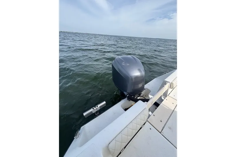 Slide: The Image of 2008 Mako 212 Center Console boat on open water, featuring an outboard motor. - 18