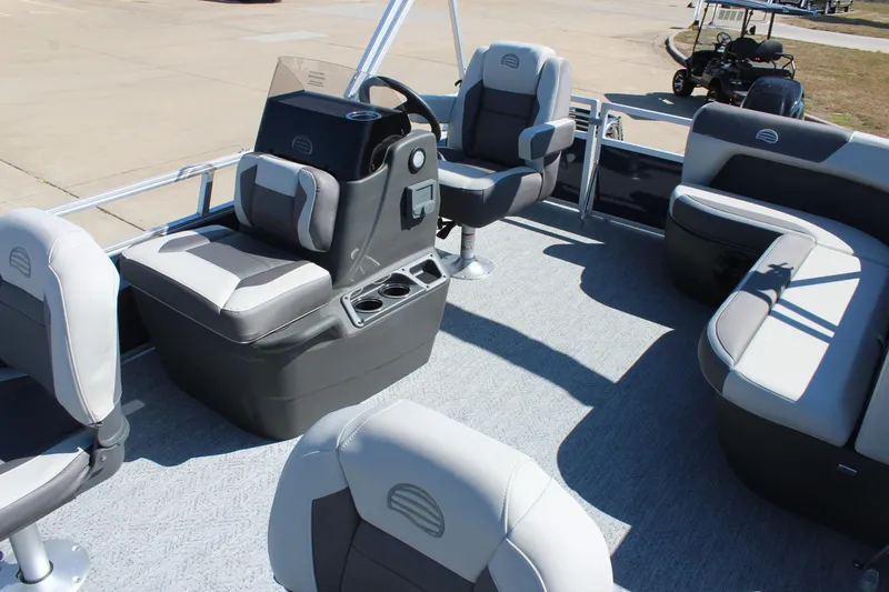 Slide: The Image of 2026 Sun Tracker Bass Buggy 16 XL Select pontoon boat interior with seating and helm. - 10
