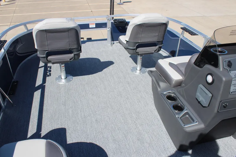 Slide: The Image of 2026 Sun Tracker Bass Buggy 16 XL Select pontoon boat interior with seating and console. - 18