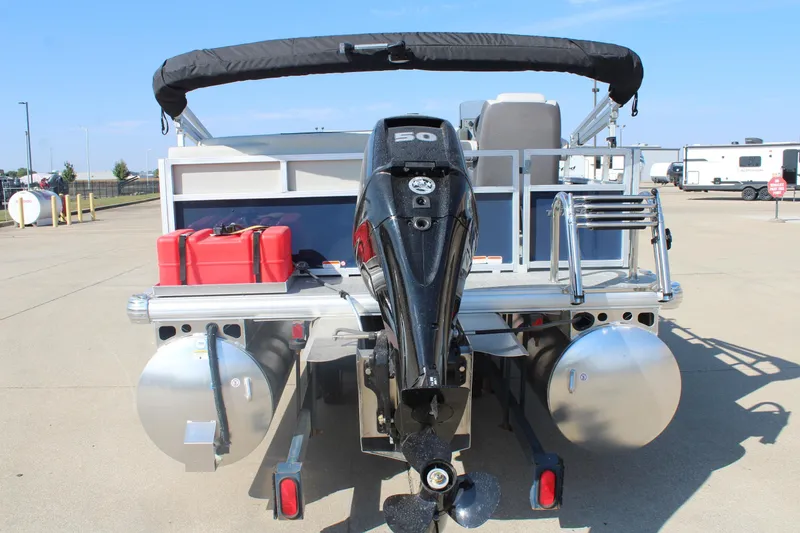 Slide: The Image of 2026 Sun Tracker Bass Buggy 16 XL Select pontoon boat with outboard motor and fuel tanks. - 6