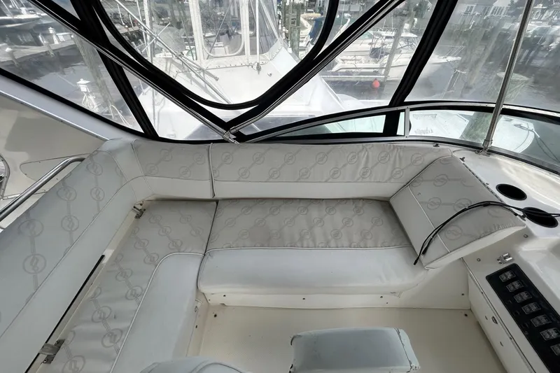 Slide: The Image of Luxurious seating area on 1997 Bayliner 3587 Motoryacht with marina view. - 15