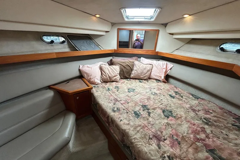 Slide: The Image of Interior of 1997 Bayliner 3587 Motoryacht with cozy bed and floral bedding. - 27