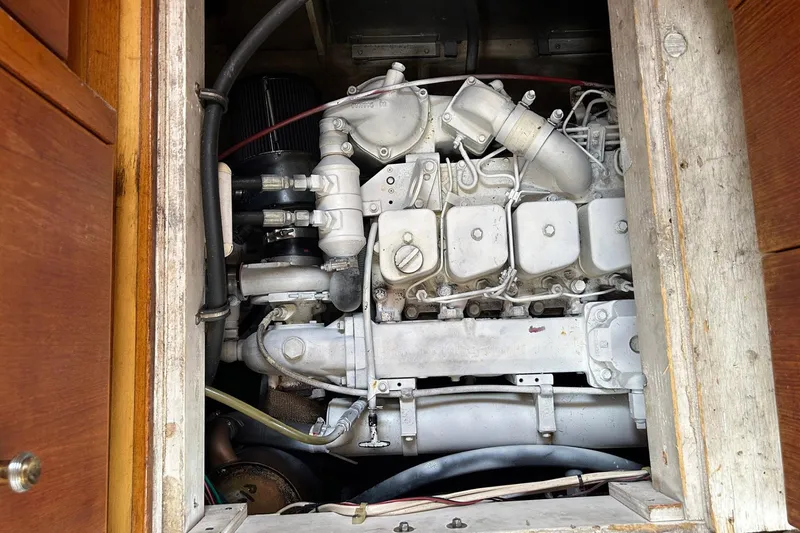 Slide: The Image of Engine compartment of a 1997 Bayliner 3587 Motoryacht, showcasing detailed mechanical components. - 36