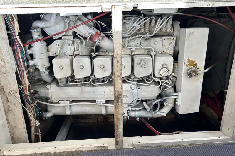 Slide: The Image of Engine compartment of a 1997 Bayliner 3587 Motoryacht, showcasing intricate mechanical components. - 38