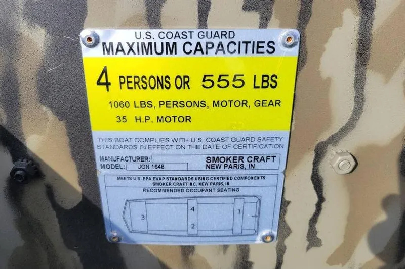 Slide: The Image of 2025 Smoker Craft 1648 jon boat capacity label, 4 persons or 555 lbs, 35 HP motor. - 5