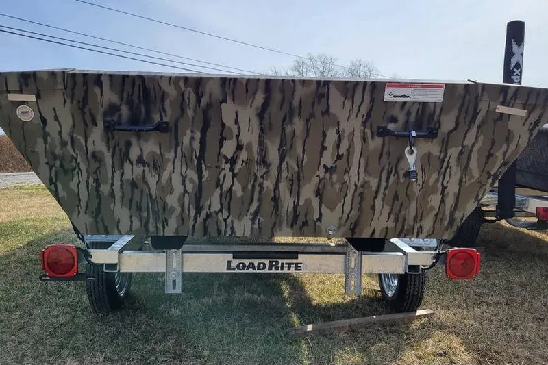 Slide: The Image of 2025 Smoker Craft 1648 jon boat with camo design on Load Rite trailer. - 4