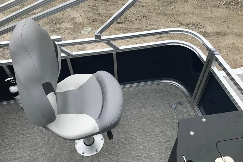 Slide: The Image of Avalon 19 Venture Quad Fish 2026 boat interior with gray captain's chair. - 11