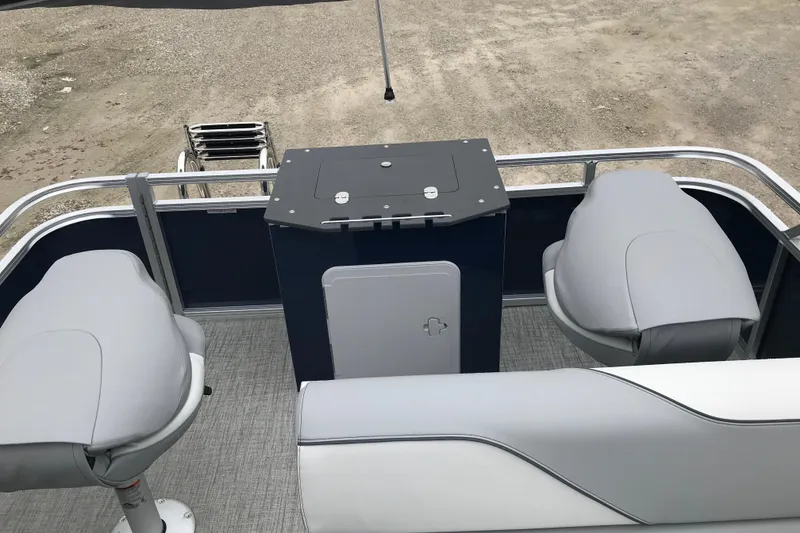 Slide: The Image of 2026 Avalon 19 Venture Quad Fish boat interior with seating and storage. - 17