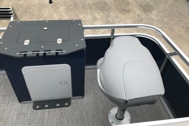 Slide: The Image of 2026 Avalon 19 Venture Quad Fish boat interior with seating and storage compartment. - 18