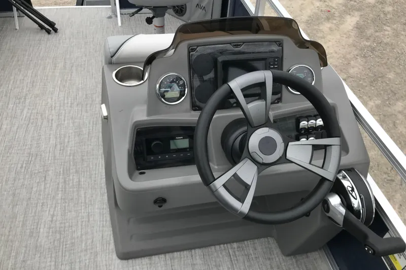 Slide: The Image of Steering console of 2026 Avalon 19 Venture Quad Fish boat with modern controls. - 19