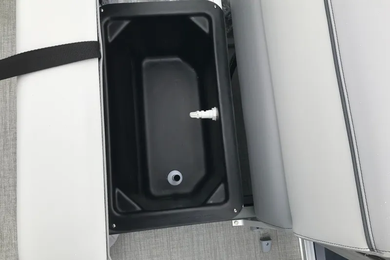 Slide: The Image of Interior view of Avalon 19 Venture Quad Fish 2026 boat with storage compartment. - 22