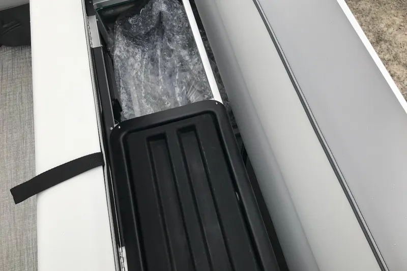 Slide: The Image of Storage compartment of 2026 Avalon 19 Venture Quad Fish boat, featuring sleek design and functionality. - 23