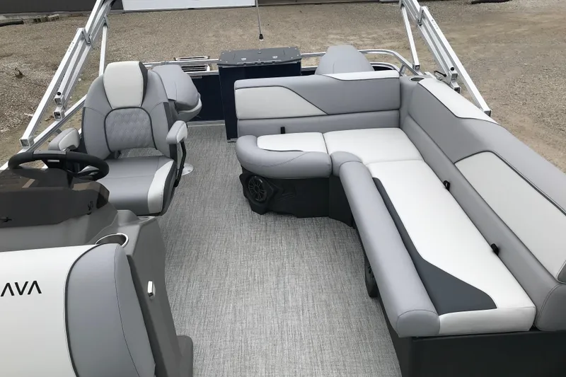 Slide: The Image of 2026 Avalon 19 Venture Quad Fish boat interior with modern seating and steering console. - 27