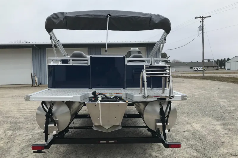 Slide: The Image of 2026 Avalon 19 Venture Quad Fish pontoon boat, rear view with canopy and seating. - 5