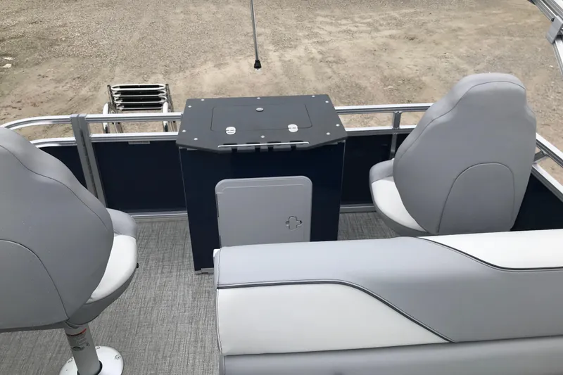 Slide: The Image of 2026 Avalon 19 Venture Quad Fish boat interior with seating and storage. - 7