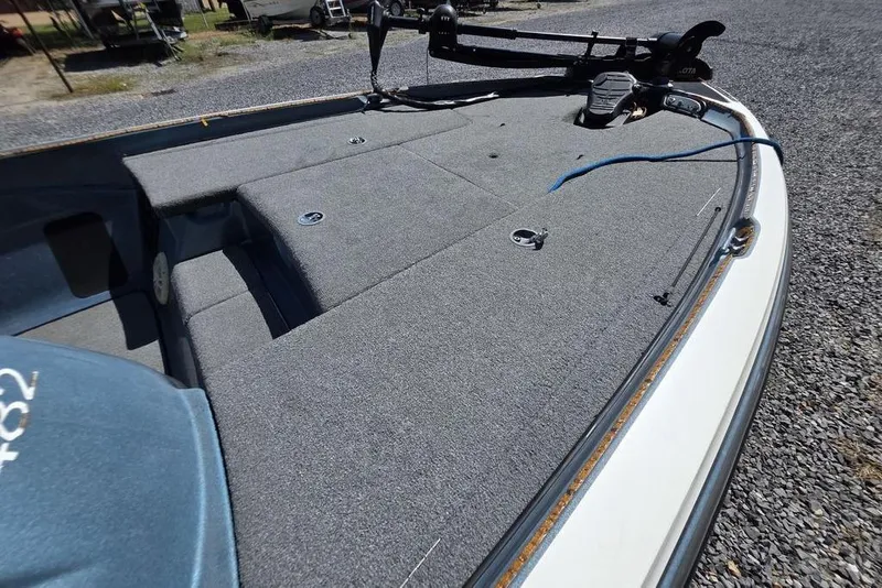 Slide: The Image of 2008 Nitro 482 DC boat deck with carpeted surface and trolling motor. - 12