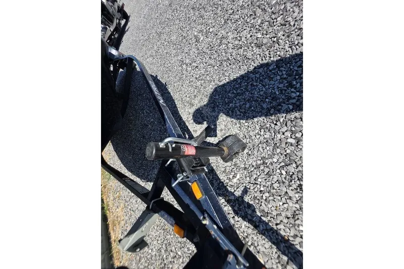 Slide: The Image of Trailer hitch of a 2008 Nitro 482 DC on gravel surface. - 13