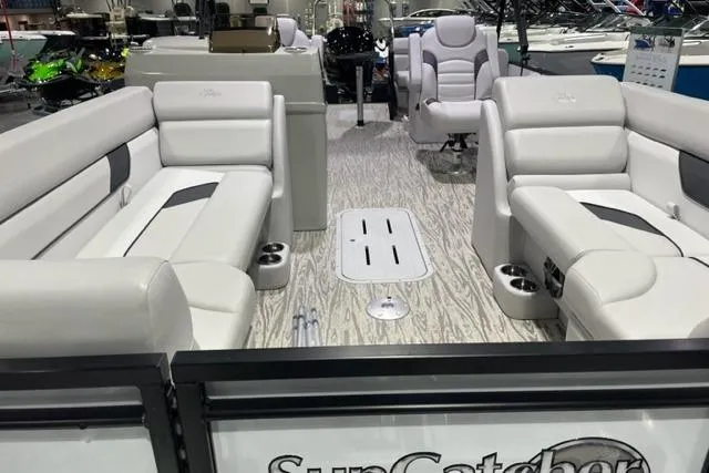 Slide: The Image of 2024 SunCatcher Select 322RC pontoon boat with luxurious seating and modern design. - 4