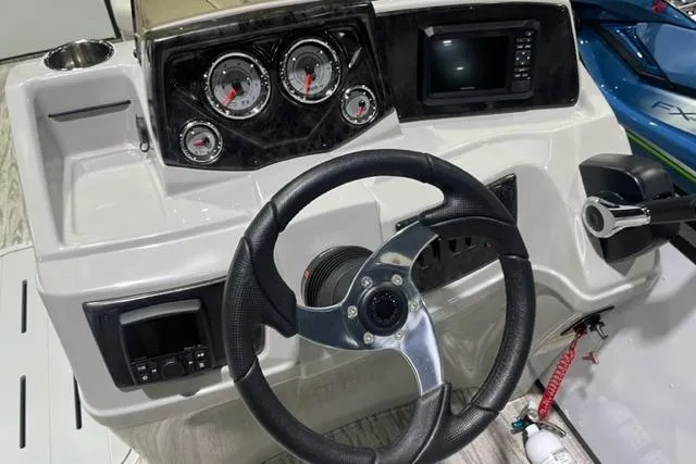 Slide: The Image of 2024 SunCatcher Select 322RC dashboard with steering wheel, gauges, and control panel. - 5