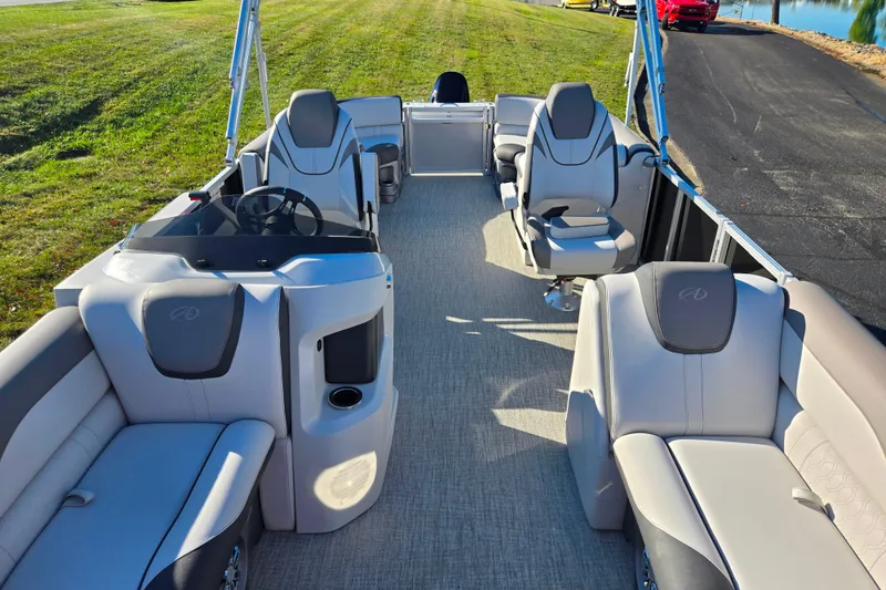 Slide: The Image of 2023 Avalon LSZ Quad Lounger pontoon boat interior with plush seating and modern design. - 12