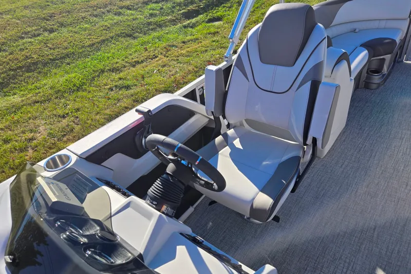 Slide: The Image of 2023 Avalon LSZ Quad Lounger boat interior with modern seating and steering wheel. - 14