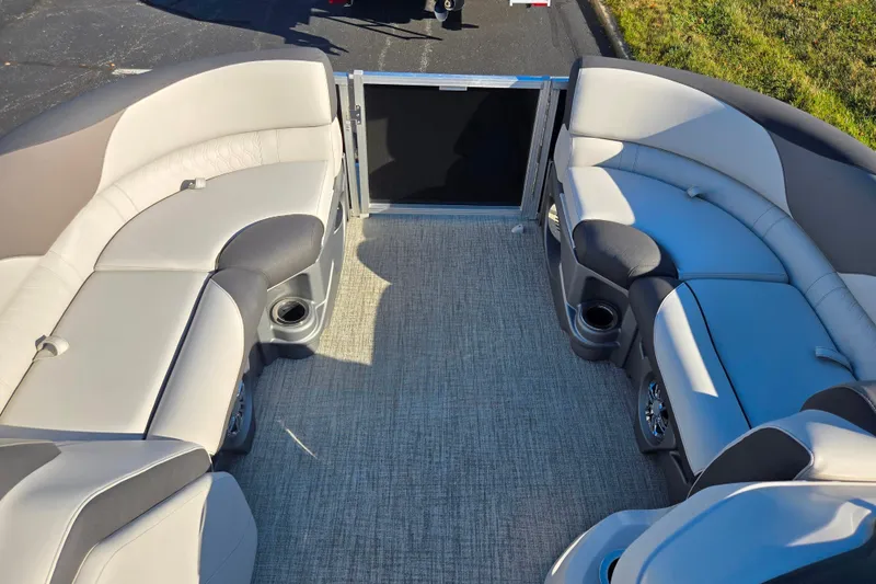Slide: The Image of 2023 Avalon LSZ Quad Lounger interior with plush seating and cup holders. - 24