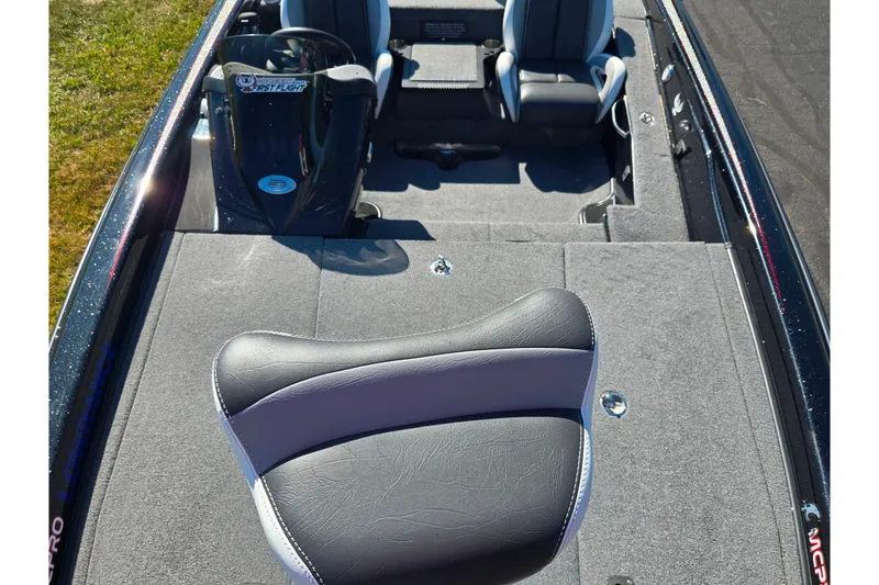 Slide: The Image of 2022 Phoenix 919 ProXP boat interior with gray seating and carpeted deck. - 15