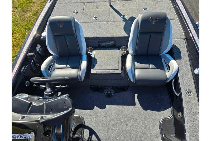 Slide: The Image of 2022 Phoenix 919 ProXP boat interior with dual seats and steering console. - 17