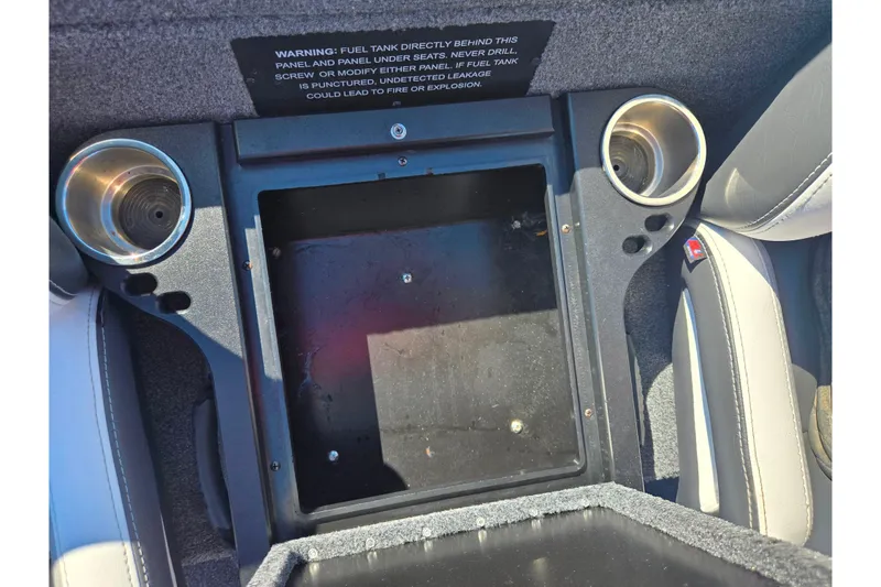 Slide: The Image of Interior of 2022 Phoenix 919 ProXP boat with cup holders and storage compartment. - 18