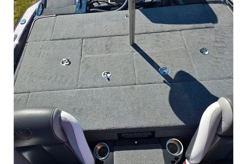 Slide: The Image of 2022 Phoenix 919 ProXP boat deck with gray carpet and seating area. - 19