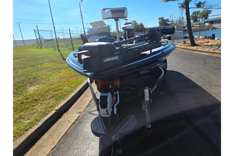 Slide: The Image of 2022 Phoenix 919 ProXP boat with Lowrance equipment, parked on a sunny day. - 7