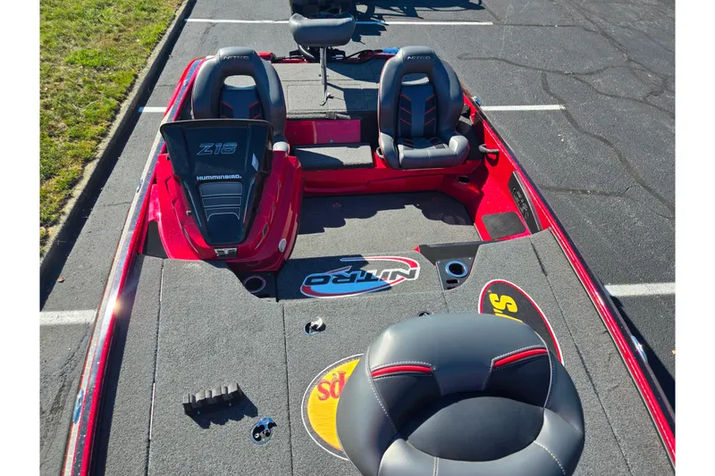 Slide: The Image of 2022 Nitro Z18 Pro boat interior with dual seats and branded carpet. - 18