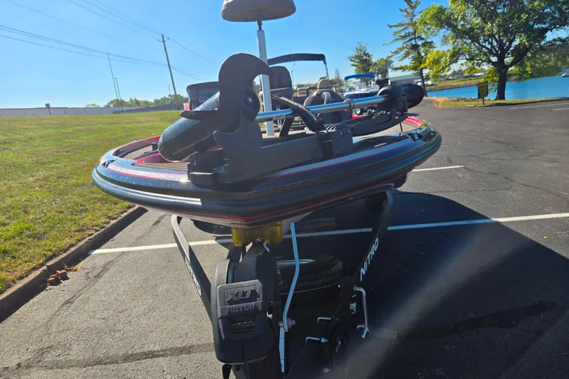 Slide: The Image of Nitro Z18 Pro 2022 boat on trailer in parking lot near lake. - 7