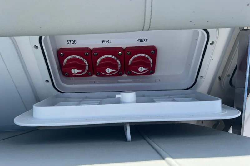 Slide: The Image of Battery switches on a 2026 Cape Horn 27XS boat, labeled STBD, PORT, and HOUSE. - 18