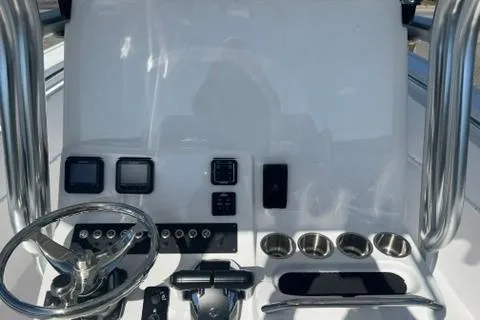 Slide: The Image of 2026 Cape Horn 27XS boat dashboard with steering wheel and control panel. - 4